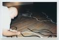 Photograph: [Photograph of a Man Working on Floor Art]