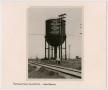 Photograph: [Small Group of Homeless Underneath a T&P Water Tower]