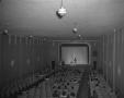 Photograph: [Woman Standing in Front of Crowd at Harlem Theater]