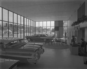 Primary view of object titled '[Interior View of an Edsel Automobile Dealership]'.