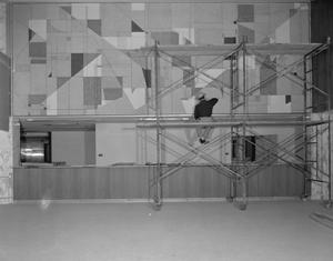 Primary view of object titled '[Man Painting a Mural at American National Bank]'.