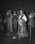 Photograph: [Woman Singing on a Stage With a Band]