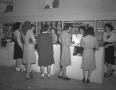 Photograph: [Women at a Check-Out Counter at the Co-Ed Shop]