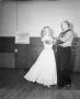 Photograph: [Mr. and Mrs. Tom Adams Square Dancing]