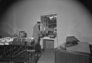Primary view of object titled '[Interior View of Drive-Through Teller Window at Austin Savings and Loan Association]'.