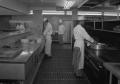Primary view of [Three Chefs Cooking in the Commodore Perry Hotel Kitchen]