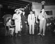 Photograph: [Five Men Entertaining People at a Party]