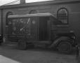 Photograph: [Railway Express Agency Truck Parked Outside a Building]