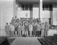 Photograph: [Group Portrait of Men Standing Outside the Beta House]