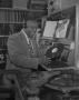 Photograph: [Dr. Hepcat Holding a Record]