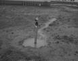 Photograph: [Negative of Water Spigot in a Puddle]