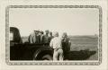 Photograph: [Workmen in Back of Pickup Truck]