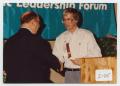 Thumbnail image of item number 1 in: '[Photograph of Dr. Duane M. Leach Shaking James Shelton's Hand]'.