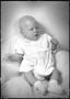 Photograph: [An infant wearing a white outfit]
