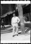 Photograph: [A young man on a sidewalk in Hollywood, California]