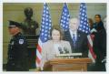 Photograph: [Photograph of Nancy Pelosi Speaking at a Podium With a Microphone]