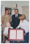 Photograph: [Congresswoman Ileana Ros-Lehitnen Handing a Framed Document to Helen…