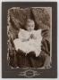 Photograph: [Portrait of Infant J. P. Baugh With Flowers #1]