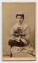 Photograph: [Portrait of a Seated Woman With Her Arms Crossed]