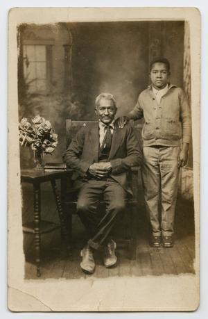 Primary view of object titled '[Postcard Picturing an Older African-American Man and Boy]'.