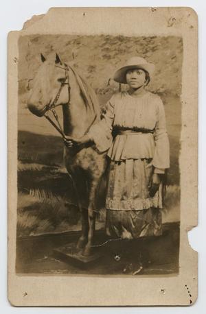 Primary view of object titled '[Postcard Picturing an African-American Girl Next to an Artificial Horse]'.