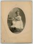 Photograph: [Photograph of a Seated Girl Holding a Teacup]