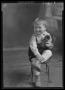 Photograph: [Portrait of Child with Toy Dog]