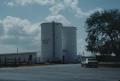 Primary view of [King Ranch NHL- Santa Gertrudis Div Headquarters, (View Facig SE of Silos at Wet End of Dairy Barn)]