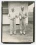Primary view of [Photograph of Two Officers Holding Trophies]