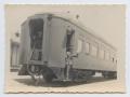 Photograph: [Photograph of a Soldier Waving on a Train]