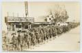 Primary view of [Postcard of Soldiers Marching by the Capitol Theater]