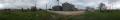 Photograph: Panoramic image of the side view of a set of grain bins in Jackson Co…